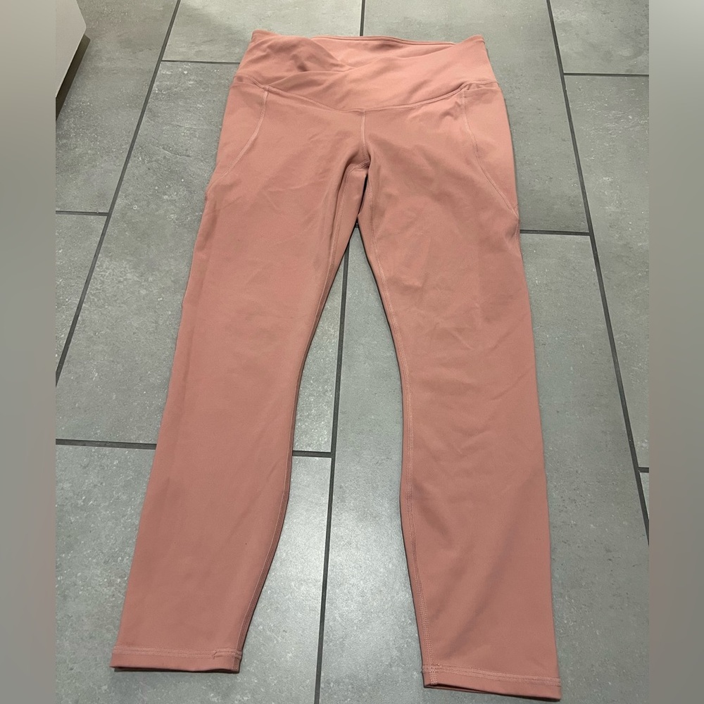 Medium. Fabletics rose colored leggings